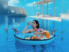 
      
      Sara Ali Khan stuns in multi-coloured bikini, enjoys floating...
      
      
