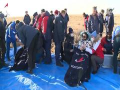
      
      US astronaut returns to Earth with two Russian Cosmonauts
      
      
