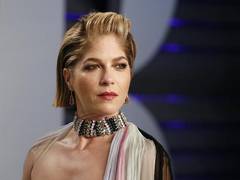 
      
      Selma Blair shows off 'peach fuzz' developed from MS treatments
      
      