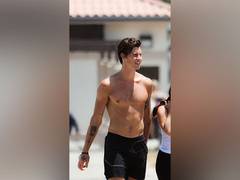 
      
      Shawn Mendes goes shirtless for a walk on the beach 
      
      
