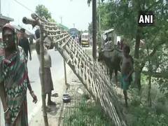 
      
      Bihar floods: Villagers put up temporary shelters; wait for...
      
      