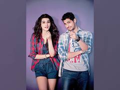 
      
      Sidharth Malhotra holds train of Kriti Sanon's dress at...
      
      