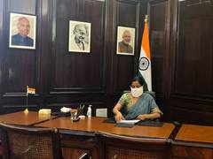
      
      Back to working in North Block office with home-made mask,...
      
      