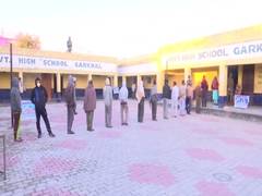 
      
      With coronavirus precautionary measures, polling underway for...
      
      
