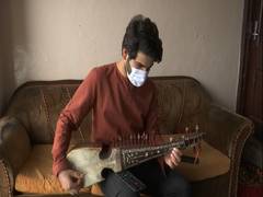 
      
      Kashmiri boy inspiring youth to learn traditional musical...
      
      