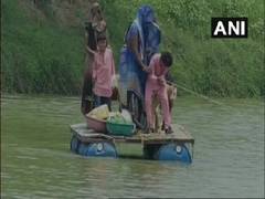 
      
      Locals in this MP village cross crocodile-inhabited river on...
      
      