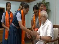 
      
      Women, school students tie rakhi on PM Modi's wrist
      
      