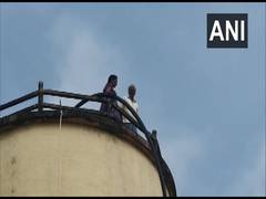 
      
      Andhra Pradesh: Elderly couple climbs water tank demanding...
      
      
