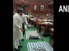 
      
      Congress MLAs protest in Karnataka Assembly over Eshwarappa's...
      
      