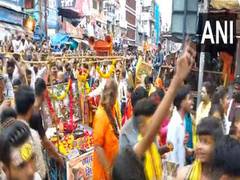 
      
      Ujjain: Devotees line up for Baba Mahakal's religious procession
      
      