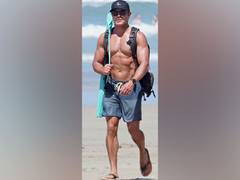 
      
      Zac Efron flaunts chiselled body while jogging shirtless on...
      
      