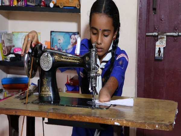 A 10-year-old amputee girl Sindhur stiches masks for SSLC students [Photo/ANI]