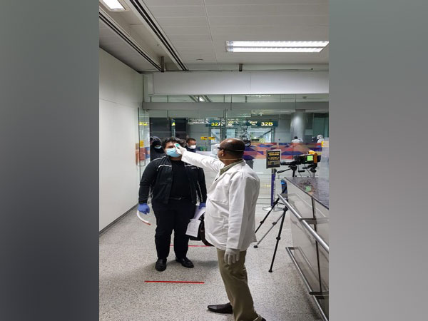 A returnee getting screened at Hyderabad International Airport for COVID-19 symptoms. [Photo/ANI]