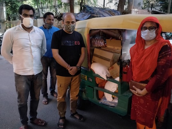 AAP MLA Dilip Pandey in black t-shirt with Shahin Hussain in orange kurta in New Delhi on Saturday. [Photo/ANI]