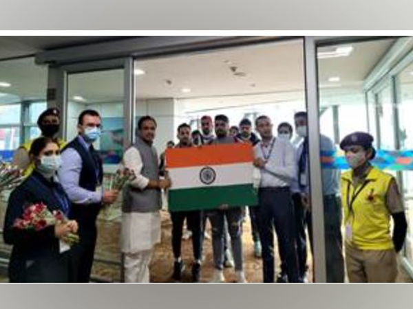 Union Minister Bhagwanth Khuba with the Indian evacuees from Ukraine, in New Delhi on Thursday.