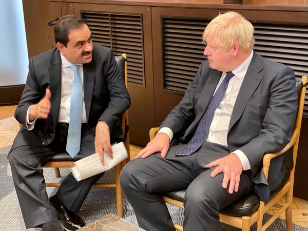 Adani group chairman Gautam Adani and UK Prime Minister Boris Johnson