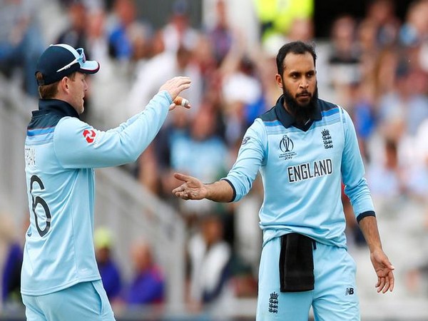 Adil Rashid celebrates with Eoin Morgan after taking a wicket