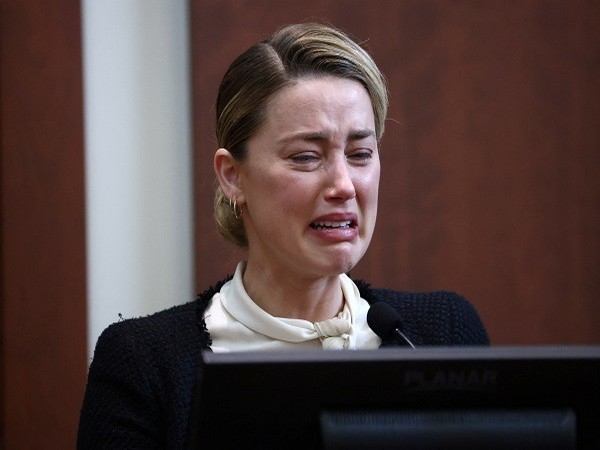 Actor Amber Heard reacts the courtroom at Fairfax County Circuit Court (Photo Credit: Reuters)