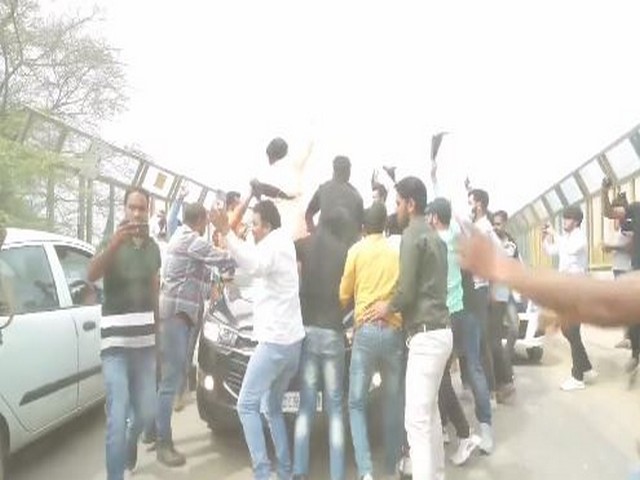 Protestors try to stop Delhi Minister Satyendar Jain's car. (Photo credit: Twitter@AamAadmiParty)
