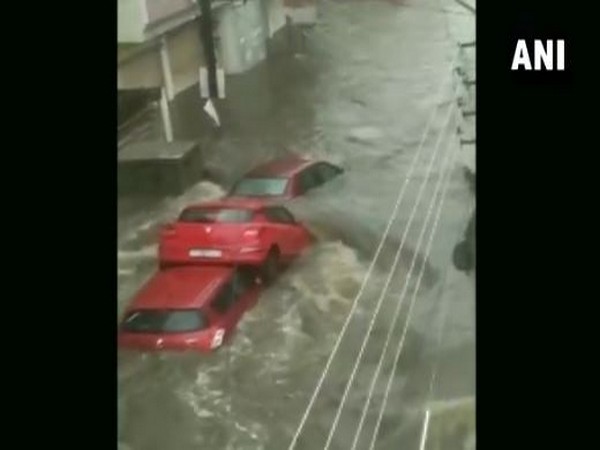 The visual of the three cars piled up on a waterlogged road in Hyderabad on Wednesday. (Photo/ANI)