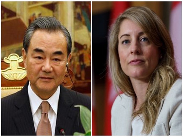 Chinese Foreign Minister Wang Yi and Canadian Foreign Minister Melanie Joly