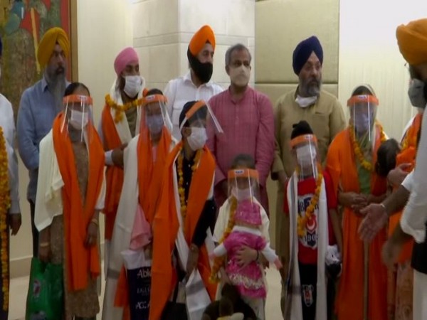 11 Afghan Sikhs abducted from a G Gurudwara last month arrive in Delhi (Photo/ANI)