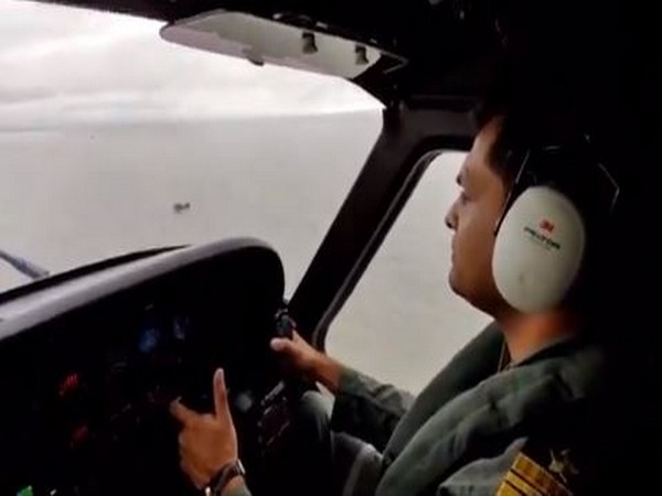 A personnel of the Indian Coast Guard warning fisherment and merchant vessesl. (Photo: Indian Coast Guard Twitter)