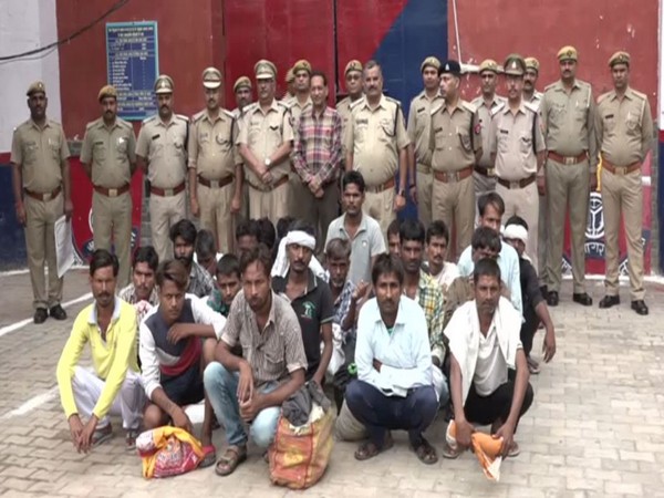 Jail authorities along with 21 prisoners who were released on Thursday in Agra. Photo/ANI