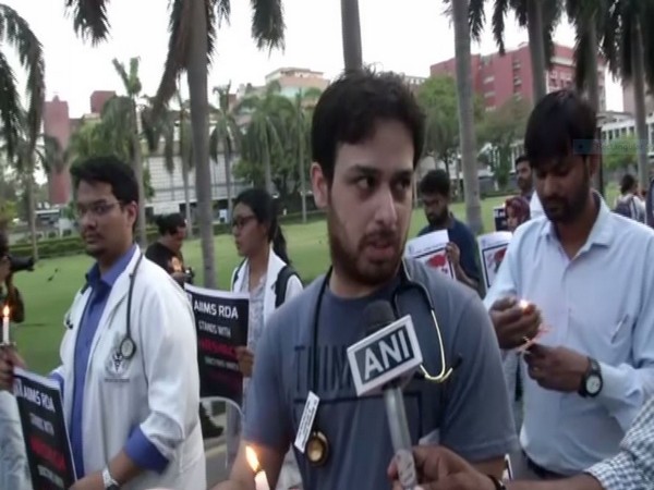 Resident doctors of AIIMS took out candle march at AIIMS in New Delhi on Saturday 