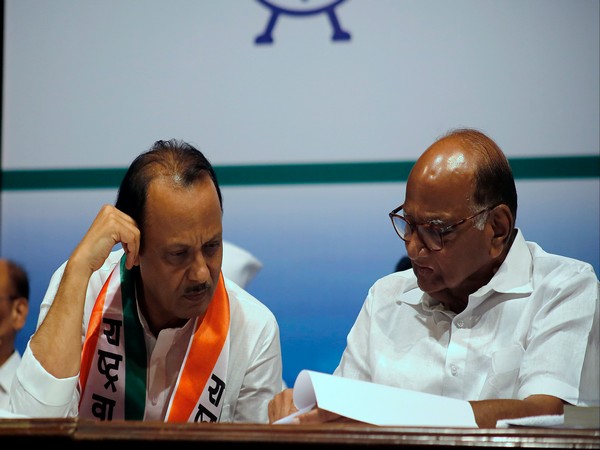 Ajit Pawar (left) with NCP chief Sharad Pawar (right)