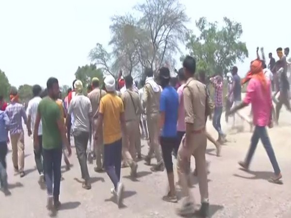 People protesting in Aligarh on Sunday against the child's murder in Tappal area of the city. (Photo/ANI)