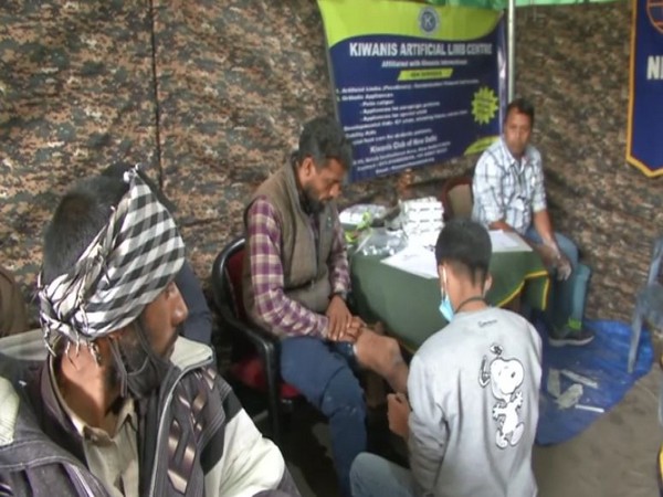 Beneficiaries giving measurements at the camp in Poonch on Tuesday.
