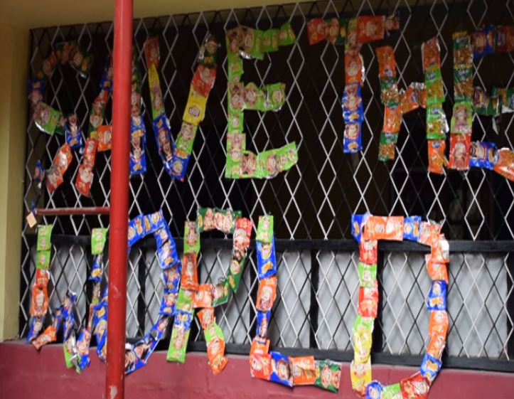 Students of Holy Cross School collect and send empty plastic wrappers back to food companies 