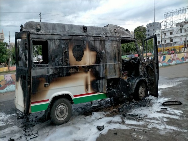 Andhra man set ablaze an ambulance in which he was being taken to hospital in Ongole town. (Photo/ANI)