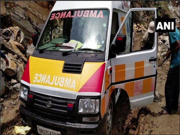 The ambulance being pushed out from the debris on a road in landslide-affected area in Pithoragarh on Wednesday. Photo/ANI
