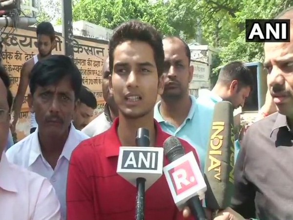 Son of BJP supporter Surendra Singh, who was shot dead early morning, talking to the media in Amethi on Sunday. (Photo/ANI)
