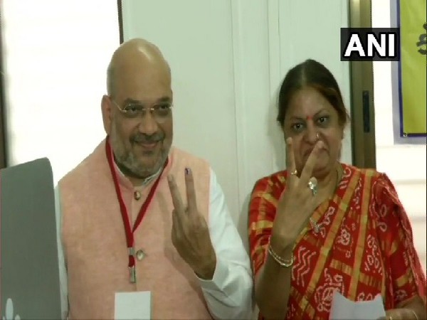 BJP president Amit Shah and his wife Sonal Shah cast vote in Ahmedabad on Tuesday Photo/ANI.