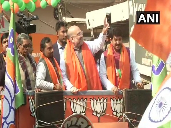 Union Home Minister Amit Shah in a road show in Delhi on Sunday.