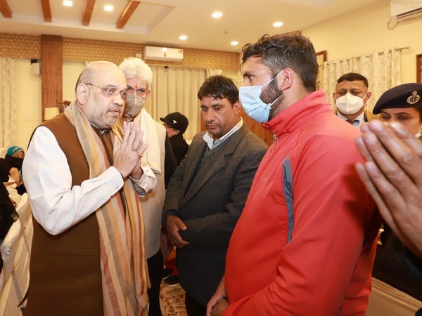 Amit Shah meeting families of soldiers, civilian killed in recent terrorist attacks in J-K this month. (Photo/Twitter: @AmitShah)