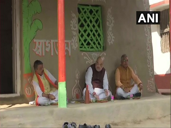 BJP leader Kailash Vijayvargiya (Left), Union Home Minister Amit Shah (Centre) and BJP leader Dilip Ghosh having lunch at farmer's house. (Photo/ANI)