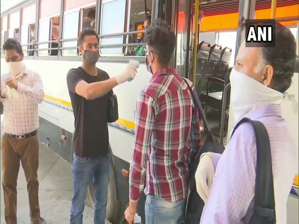 Passengers screened before boarding the public buses in Amritsar