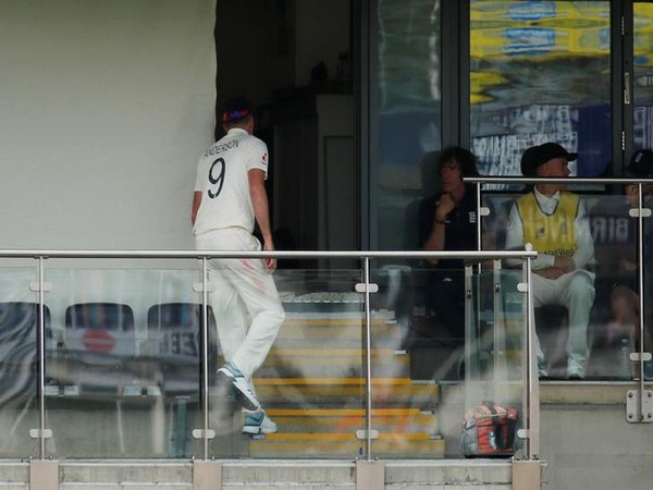 England's James Anderson walks inside the pavilion after sustaining tightness to his right calf
