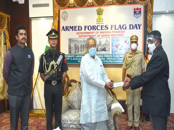 Andhra Pradesh Governor handing over the cheque to Army Officials for transferring same to wife of killed soldier.