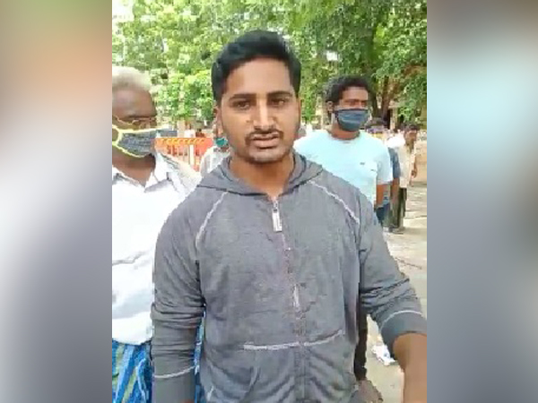 A person standing in the queue in Narasaraopeta, Andhra Pradesh 