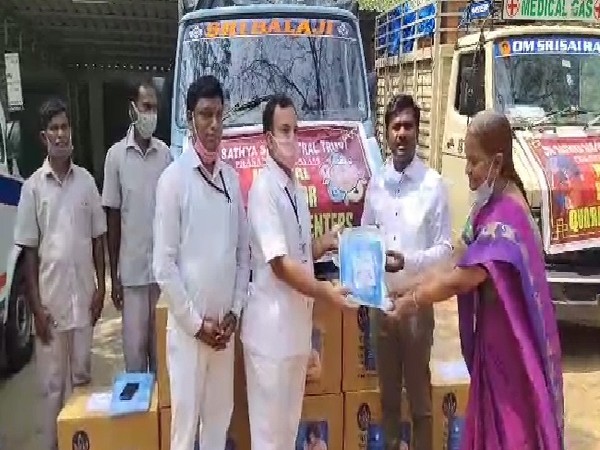 A visual of Sri Satya Sai Central Trust members donating PPE kits in on Friday.