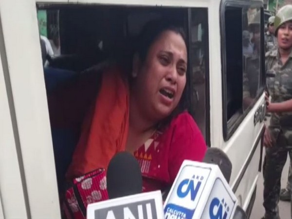 A BJP worker being taken into custody by the police in North 24 Parganas on Sunday. (Photo/ANI)