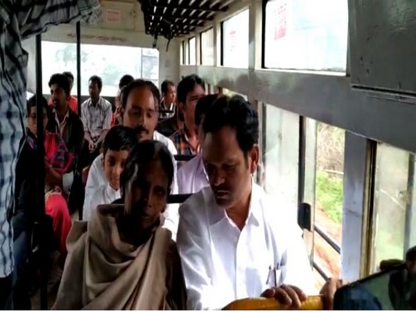 Araku MLA Chetti Phalguna interacts with a commuter in a APSRTC bus in Vishakapatnam on Friday. [Photo/ANI]