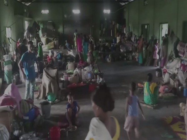 Visuals of flood victims who are lodged in a community hall in Chirang district in Assam. (Photo/ANI)