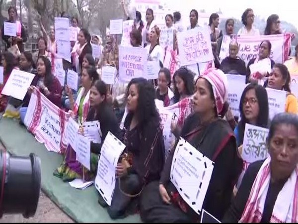 Women stage sit-in against CAA in Assam. Photo/ANI