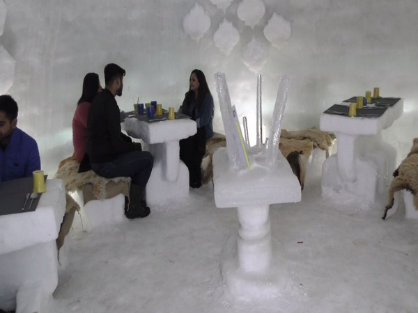 Tourist enjoying at Igloo Cafe at Gulmarg on Saturday. (Photo/ANI)